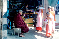 Buddhist nuns asking alms in Yangon, Myanmar